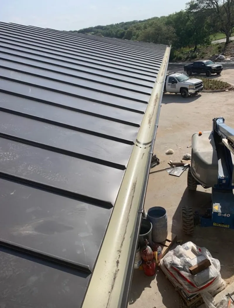 Standing seam panel and gutter detail on a metal roofing jobsite in Rancho Palos Verdes